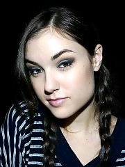 Sasha Grey restrained in a tight straitjacket and leather straps.